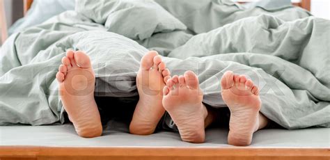 Feet Of Couple In The Bed Stock Image Colourbox