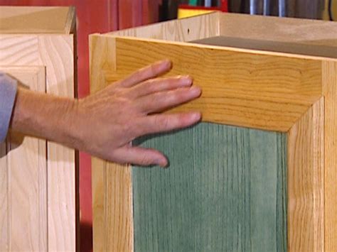To apply the stain, use a rag and rub the stain into the wood going along with the grain. How to Stain Wood Cabinets | how-tos | DIY