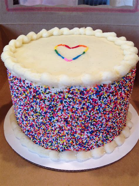A Cake With Sprinkles And A Heart On It