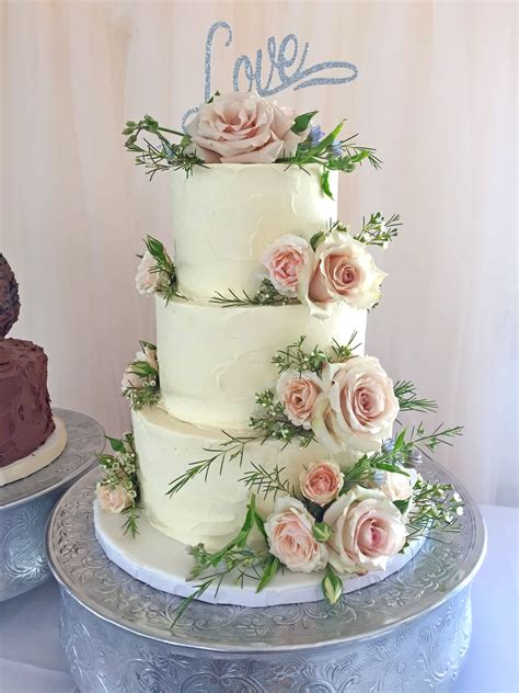 Decoration ideas of this beautiful canvas are literally endless. Buttercream wedding cake with light pink roses | Pink ...