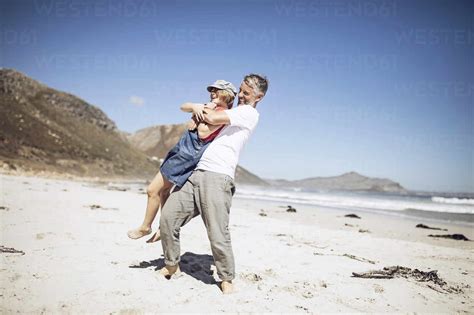 Father And Daughter Having Fun Together On The Beach Cape Town