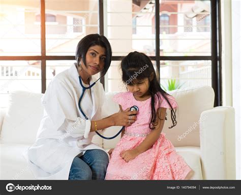 Indian Female Doctor Treating Young Girl Patient — Stock Photo