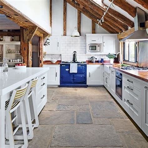 A hard, durable option like natural stone tiles is a great kitchen option. 25 Stone Flooring Ideas With Pros And Cons - DigsDigs