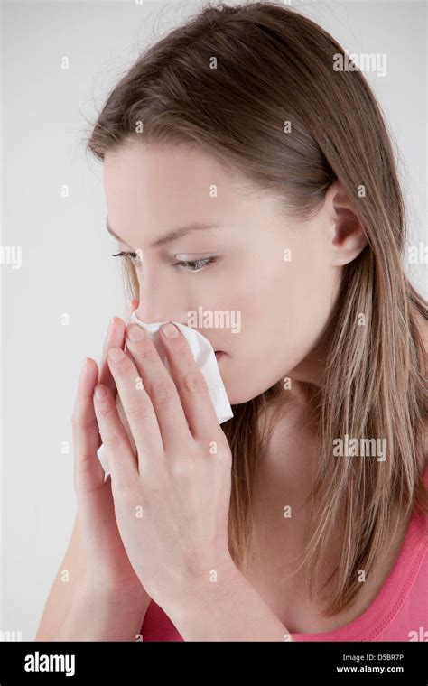 Woman Blows Her Nose Stock Photo Alamy