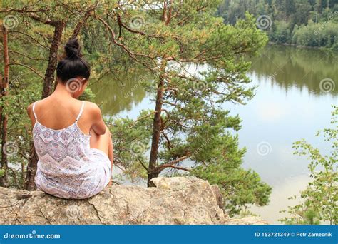 Pretty Girl Sitting On Rock Watching Water Stock Image Image Of Sitting Girl 153721349