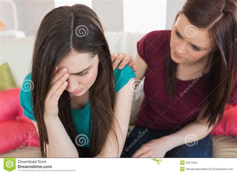 Girl Comforting Her Crying Friend On The Couch Stock Image Image