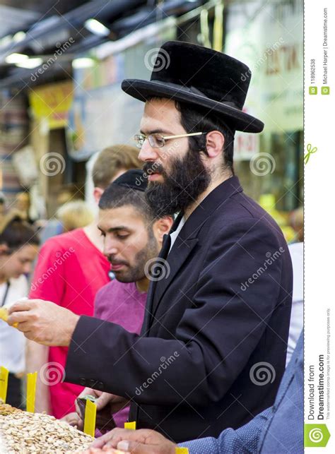An Orthodox Chassidic Making A Purchase From A Stall In The Mahane