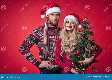 Portrait Of Married Couple Christmas Holiday Red Background Stock Image
