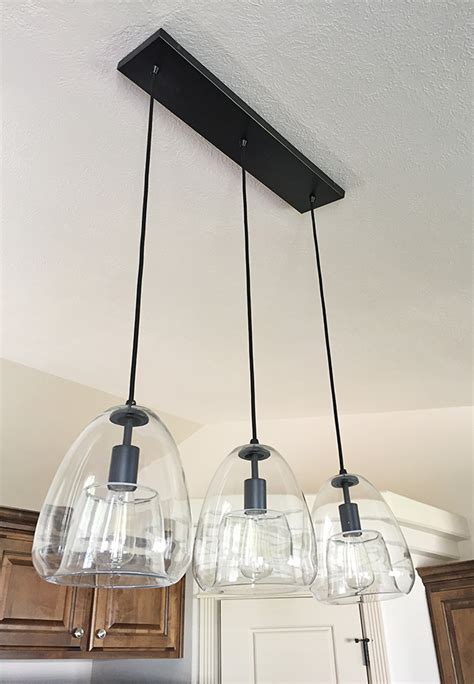 These kitchen island pendant light ideas will help transform the heart of your home. 2 Little Love Birds: our kitchen & tips for installing ...