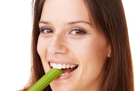 Enjoying A Healthy Snack Portrait Of An Attractive Young Woman Biting