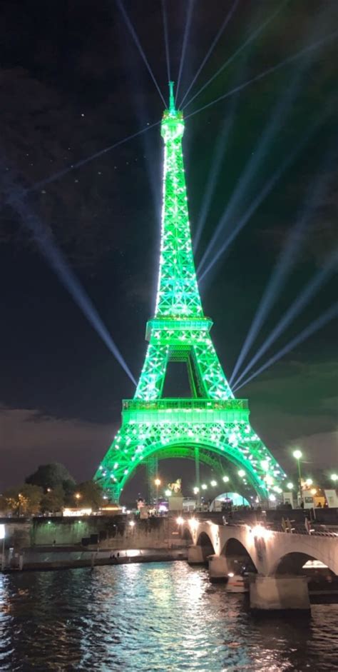Eiffel Tower Lit Up In Green