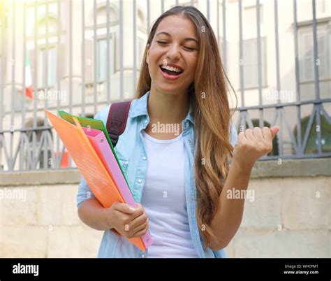 Excited Student Girl Raising Fist Up Outdoors Stock Photo Alamy