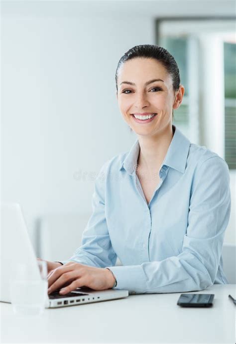 Smiling Young Businesswoman Working At Office Desk Stock Image Image