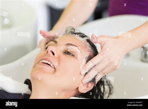 A Woman Getting Her Hair Washed In A Salon Sink Locarno Ticino Switzerland Stock Photo Alamy