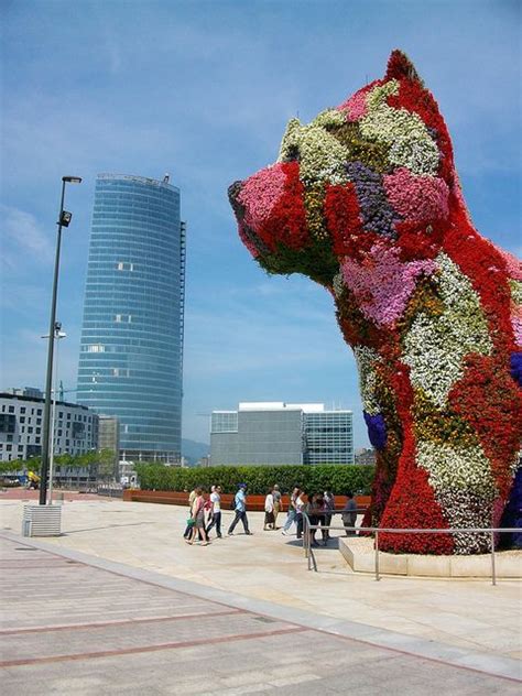 The miniature replica puppy comprised of dried flowers sitting atop of a plastic base foundation (printed on base. Jeff Koons' "Puppy" near Guggenheim Museum | Jeff koons ...