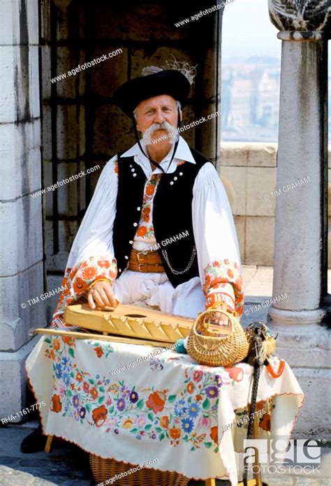 Hungarian Man In Traditional Clothing With Hungarian Musical Instrument
