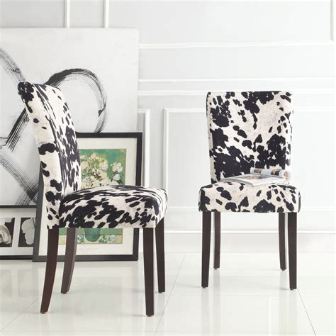 Supple leathers and cowhides are combined with richly finished woods and accents to create great custom designs that offer comfort and lasting quality. Portman Cow Hide Parson Dining Chairs (Set of 2) by ...
