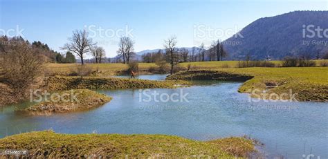Young Men At Blue River On Karst Field Planinsko Polje Stock Photo