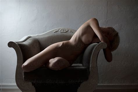 Naked Woman Lying On The Sofa By Stocksy Contributor Sonja Lekovic
