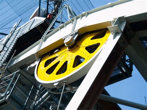 Close Up View Of Yellow Steel Giant Wheel Of Cableway Stock Photo