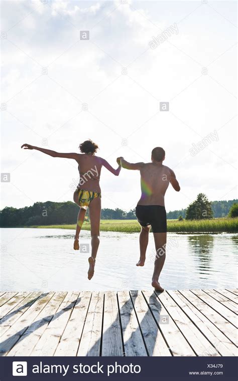 Couple Jumping Lake High Resolution Stock Photography And Images Alamy