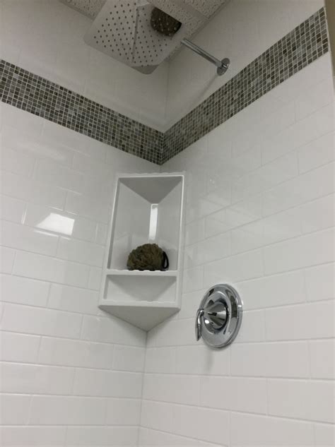 Here are the details as of now after that i followed the swanstone installation instructions and used ge silicone ii on the back of the surround walls and set the walls with wood. Swanstone Vs Corian Shower - Corian House