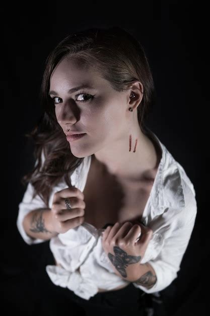 Premium Photo Portrait Of Young Woman Showing Wounds On Neck Against