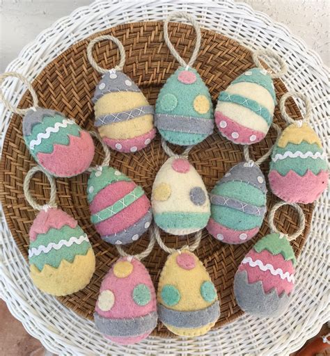 A Basket Filled With Lots Of Decorated Eggs