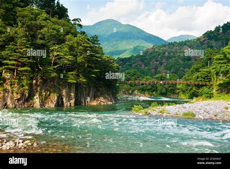 Beautiful Landscape In The Japanese Mountains With A Wild River Red