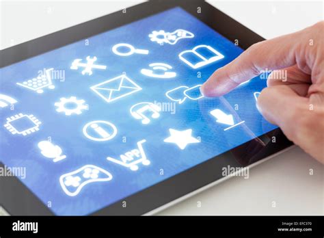 Clicking on a tablet with touchscreen interface Stock Photo - Alamy