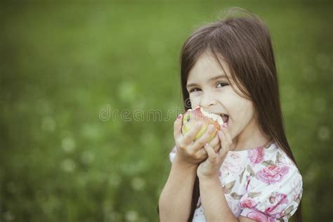 392 Little Girl Biting Apple Stock Photos Free And Royalty Free Stock