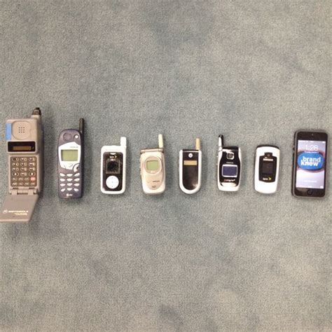 There Are Many Different Cell Phones Lined Up In A Row On The Floor