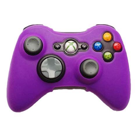 A Close Up Of A Purple Controller For A Game System With Four Different