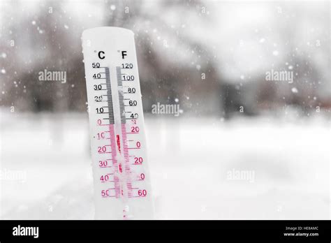 Thermometer On Snow Showing Very Low Temperature Stock Photo Alamy