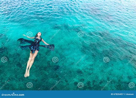 Woman In Dress Relaxing Lying On The Water Stock Image Image Of