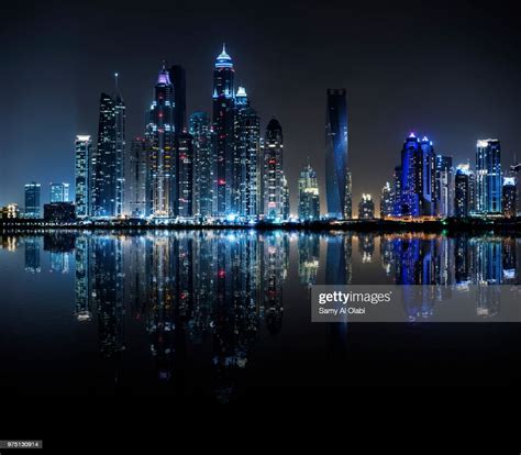 Night View Of Dubai Marina Reflected In Water Dubai United Arab