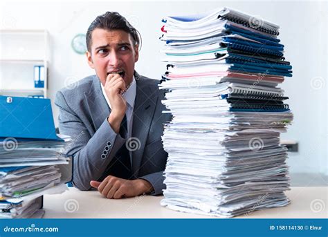 Businessman With Heavy Paperwork Workload Stock Photo Image Of
