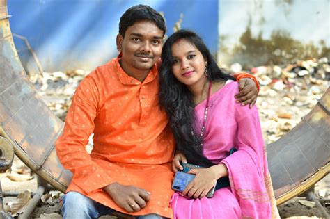 Married Indian Couple Sitting Together Wearing Traditional Ethnic Dress