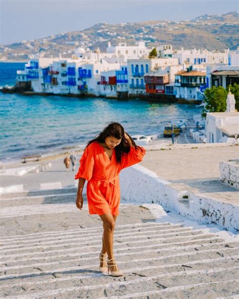 Premium Photo Mykonos Greece Young Woman In Dress At The Streets Of