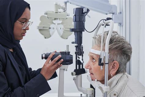Eye Exam Optometrist And Senior Woman In Clinic For Test Eyesight And