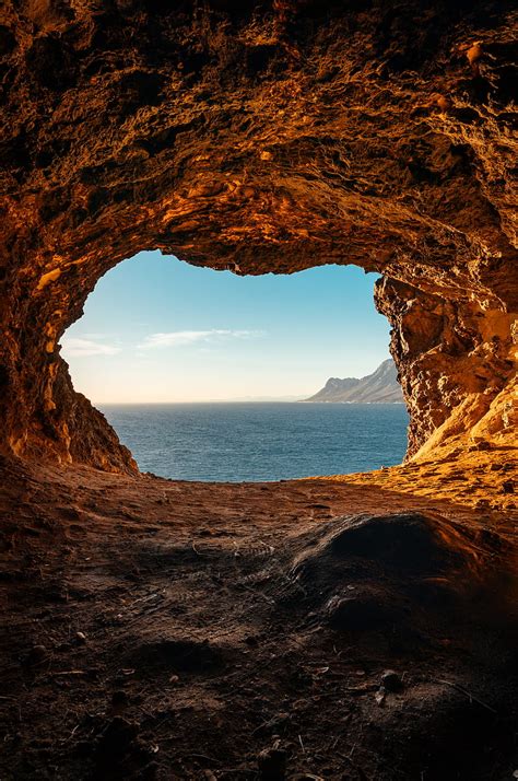 Rock Cave Sea Lonely Man Rock Cave Hd Mobile Wallpaper Peakpx