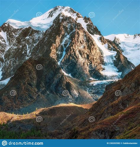 Snowy High Altitude Alpine Landscape With Snow Capped Mountain Peak And
