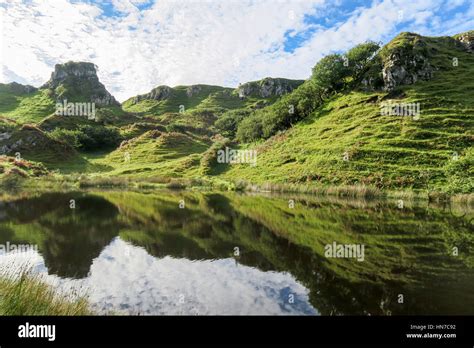 The Magical Green Hills Of Fairy Glen On The Isle Of Skye Scotland