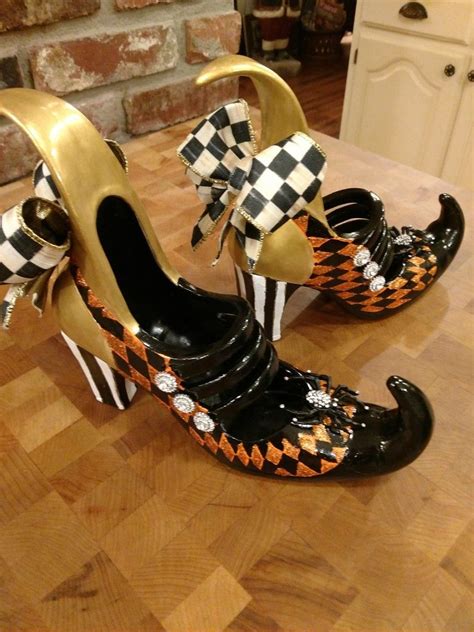 Diy witch's shoes, you could also put socks and witch shoes on the legs of a table. Makenzie Childs inspired witch's shoes, Halloween decor, witch's shoes | Witch shoes, Halloween ...