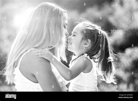 Kids Love Lifestyle Portrait Mom And Daughter In Happy Mood At The
