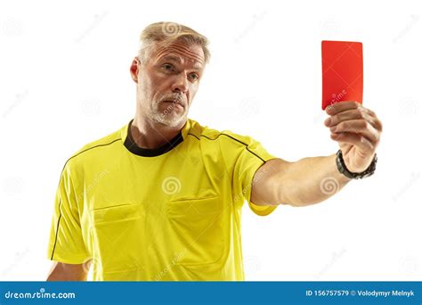Football Referee Showing A Red Card To A Displeased Player Isolated On