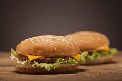 Fresh Burgers On Wooden Table Stock Photo Image Of Brown Cheese
