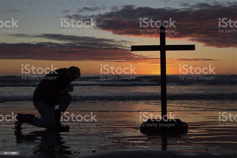 Man Kneeling Cross Stock Photo Download Image Now Beach