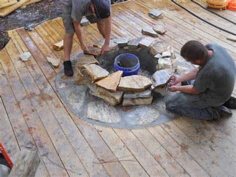 We did not find results for: Craftsmen constructing a natural stone fire pit on wooden ...