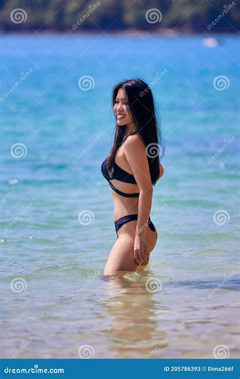 beautiful asian woman posing on a tropical beach stock image image of ocean sensuality 205786393